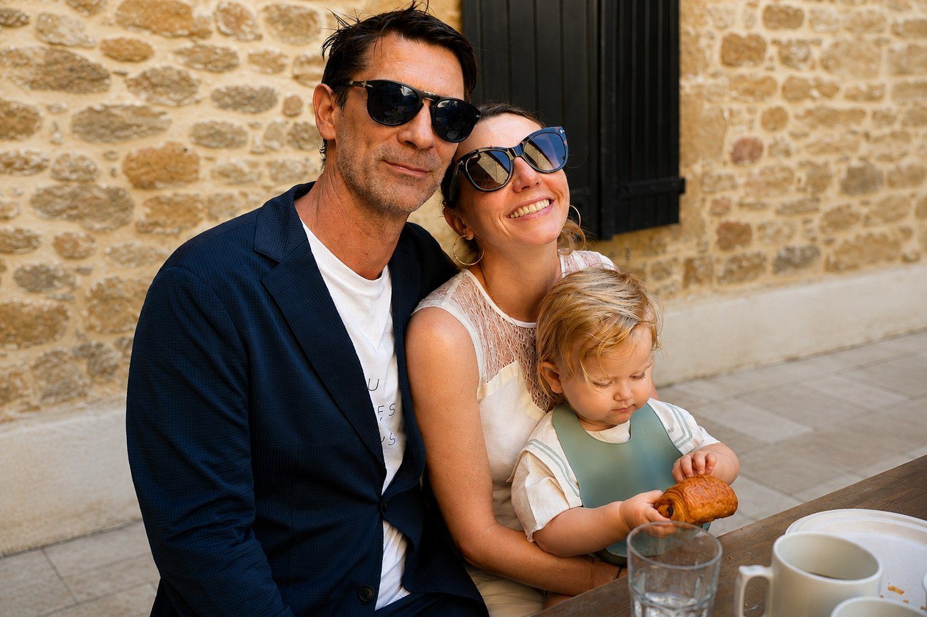 Family portrait, parents and toddler at a cafe table